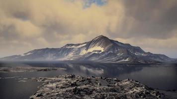 Mountains covered with ice in Antarctic landscape photo