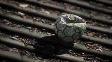 old soccer ball on the roof of a house photo