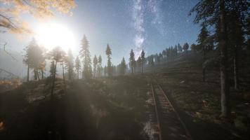 The milky way above the railway and forest photo