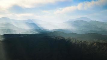 aerial vulcanic desert landscape with rays of light photo