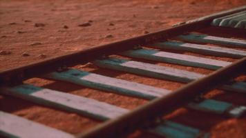 Abandoned railway tracks in the desert photo