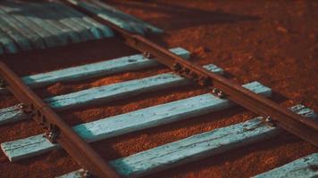 Abandoned railway tracks in the desert photo