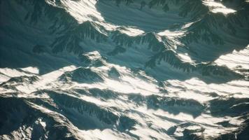 Aerial view of the Alps mountains in snow photo