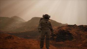 Spaceman walks on the red planet Mars. Space Mission photo