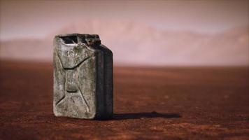 old rusty fuel canister in the desert photo