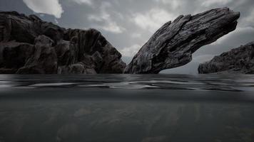 Half underwater in northern sea with rocks photo