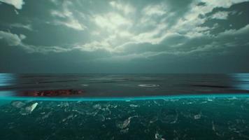 Split view over and under water in the Caribbean sea with clouds photo