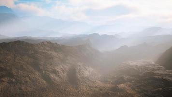 aerial vulcanic desert landscape with rays of light photo