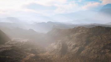 aerial vulcanic desert landscape with rays of light photo