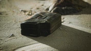 old rusty fuel canister in the desert photo