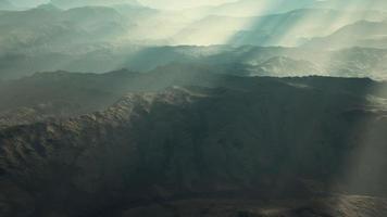 aerial vulcanic desert landscape with rays of light photo