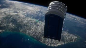 Portable street WC toilet cabin on Earth orbit photo