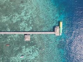 Blue turquoise water sea island with green tree summer vacation background by drone photo