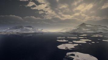 Mountains covered with ice in Antarctic landscape photo