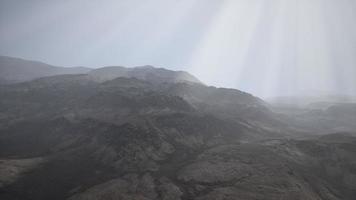 Sun Rays against the Backdrop of the Mountains photo