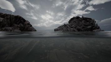 Half underwater in northern sea with rocks photo