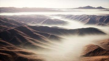 mountain landscape with deep fog at morning photo