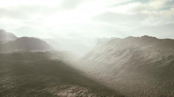 aerial vulcanic desert landscape with rays of light photo