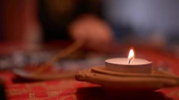 Burning Candle on a Magical Table of Woman Fortune-teller