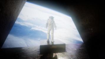 astronaut on the space observatory station near Earth photo