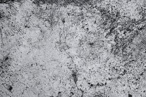 Old grunge dirty textured cement wall surface. With uneven stains and tiny holes.