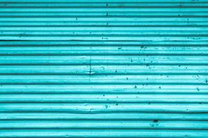 Blue colored metal store front iron curtain texture background photo