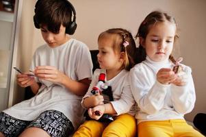 Kids using microscope learning science class at home. photo