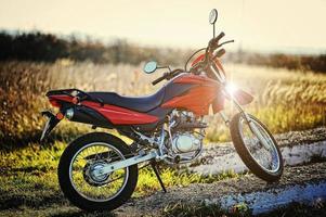 Enduro motorcycle stay on sunset sunshine photo