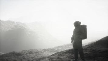 astronaut on another planet with dust and fog photo