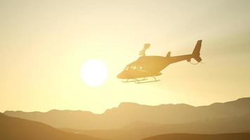 extreme slow motion flying helicopter and sunset sky photo