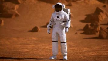 Astronaut on Mars Surface. Red Planet Covered in Gas and rock photo