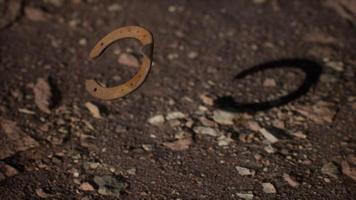 extreme slow motion old rusty metal horseshoe photo