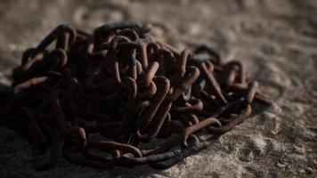 Vintage rusty hand-made iron chain photo