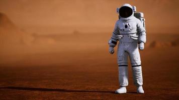 Astronaut on Mars Surface. Red Planet Covered in Gas and rock photo