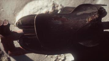 Rider Leather Saddle on fence in desert photo