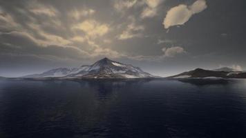 Mountains covered with ice in Antarctic landscape photo