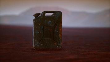 old rusty fuel canister in the desert photo