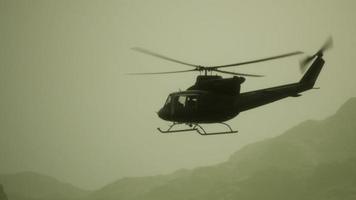 Slow Motion United States military helicopter in Vietnam photo