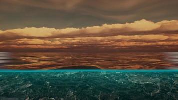 Split view over and under water in the Caribbean sea with clouds photo