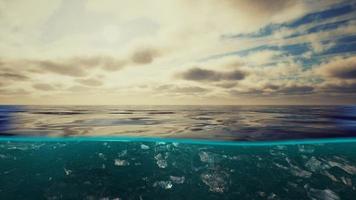 Split view over and under water in the Caribbean sea with clouds photo