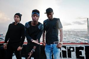 Three rap singers band on the roof photo