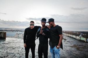 Three rap singers band on the roof photo