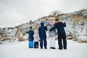 Back of scandinavian family with Sweden flag in winter swedish landscape. photo