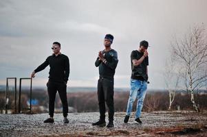 Three rap singers band on the roof photo