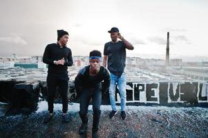 Three rap singers band on the roof photo