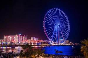 Beautiful Dubai eye or Ain Dubai on the Jumeirah beach at night. Beautiful lights of the ferris wheel in Dubai photo