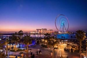 Beautiful Dubai eye or Ain Dubai on the Jumeirah beach at sunset. Magical sunset time in Dubai by the Ferris wheel. photo