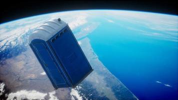 Portable street WC toilet cabin on Earth orbit photo