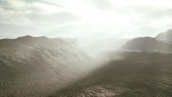 aerial vulcanic desert landscape with rays of light photo