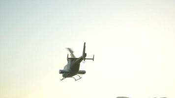 8K extreme slow motion flying helicopter and sunset sky photo